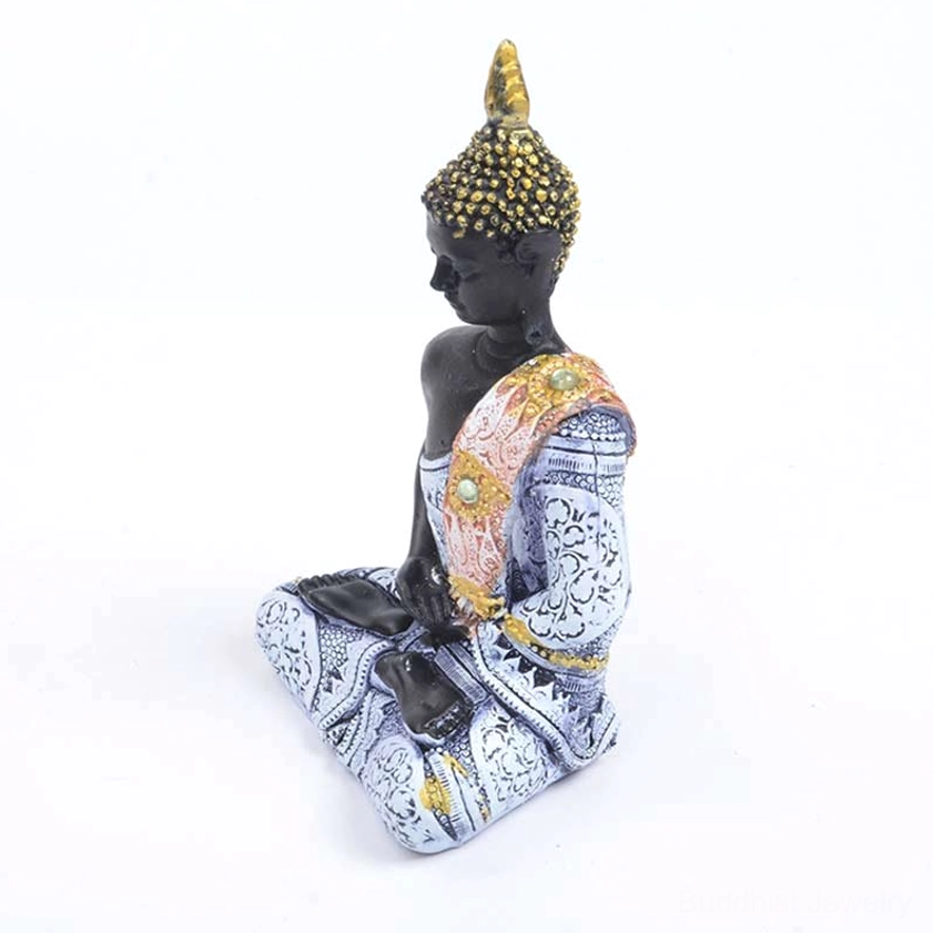 Buddhist statue side profile view showing blue robe, gilded ornament, and crossed leg sitting position