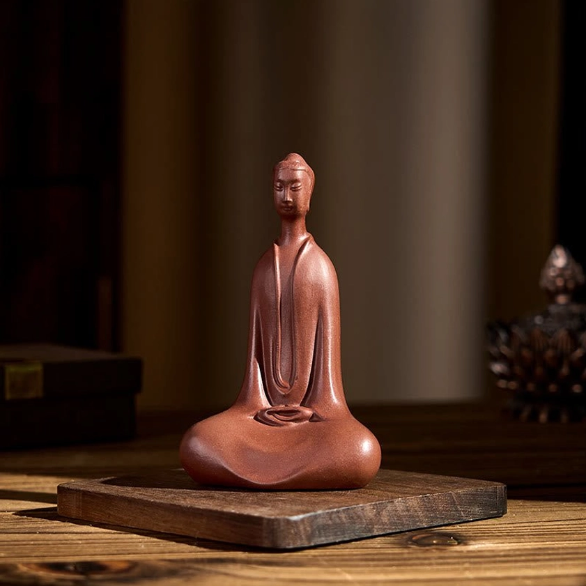 Handmade purple clay Buddha side profile showing meditation pose and matte texture