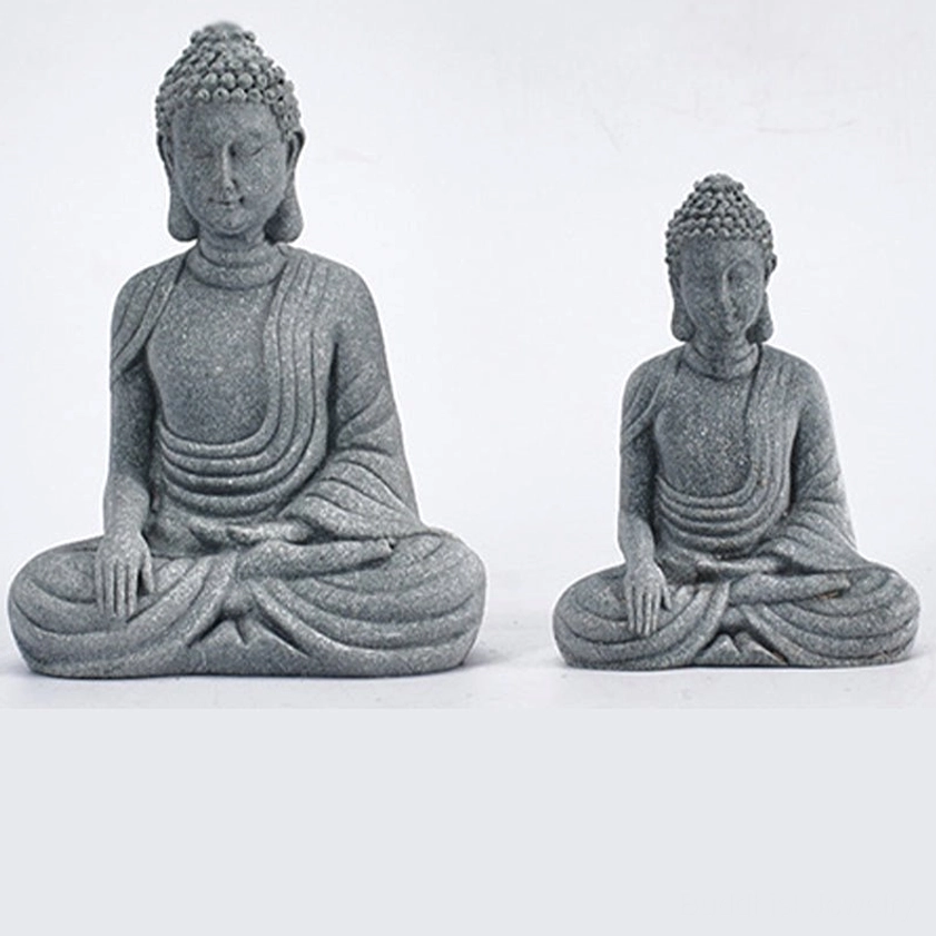 Two sizes of handcrafted sandstone Buddha statues side by side, identical seated meditation poses showing small and large size comparison