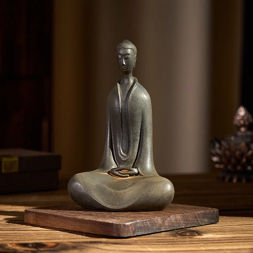 Buddha resin statue texture detail showing iron powder rust finish and matte surface quality