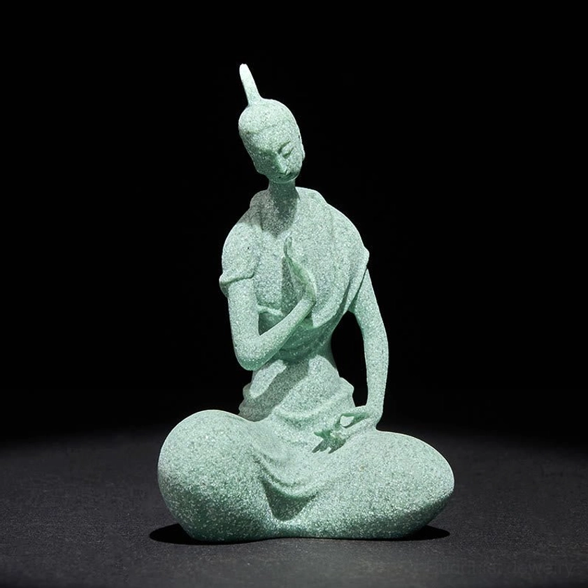 Sandstone Buddha statue front view, rough textured matte green finish, classic meditation posture against dark background