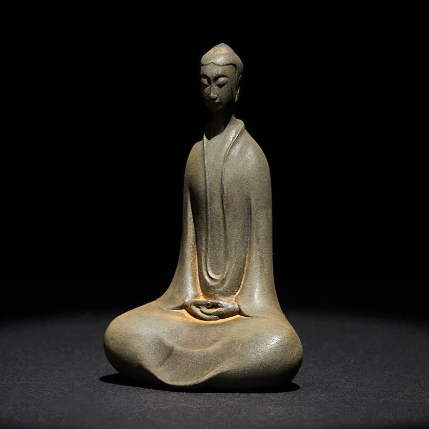 Seated Buddha decorative figurine three-quarter angle showing serene expression and traditional robe details