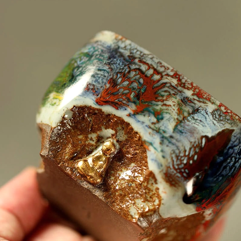 Dunhuang hand-painted Buddha Shino ceramic teacup lifestyle image showing mindful tea ceremony practice with meditation setting