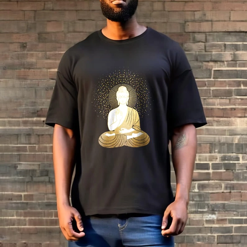 Man wearing black meditation Buddha graphic t-shirt with golden aura outdoor brick wall casual style