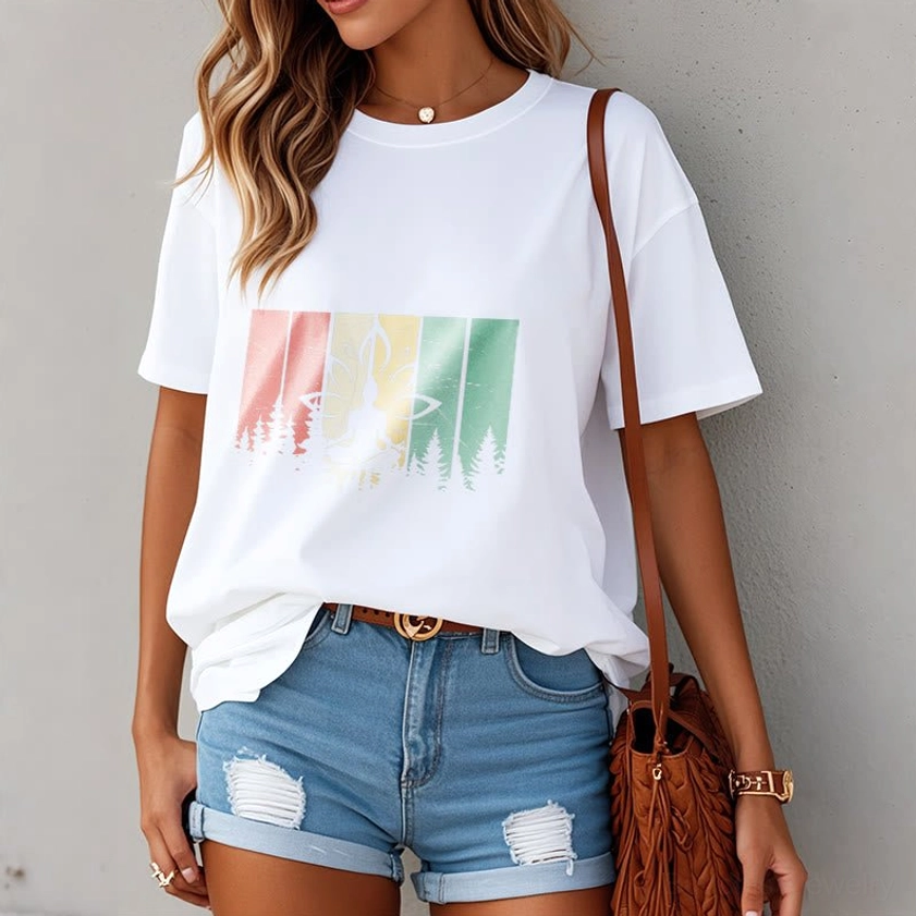 Woman wearing white Buddhist lotus meditation t-shirt with forest print design in everyday casual indoor setting