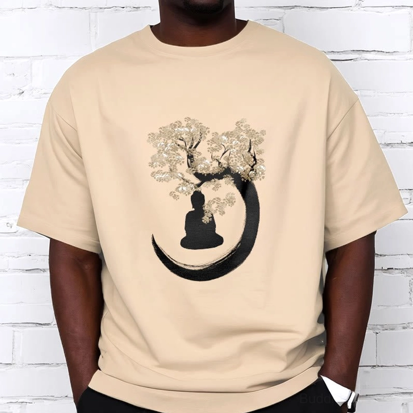Male model wearing beige Buddhist enlightenment t-shirt with crescent moon and tree print design