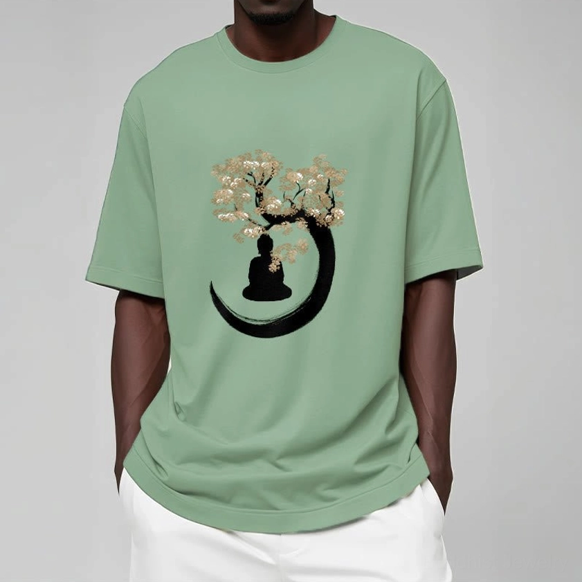 Male model wearing pale green Buddhist enlightenment t-shirt with tree and crescent moon motif