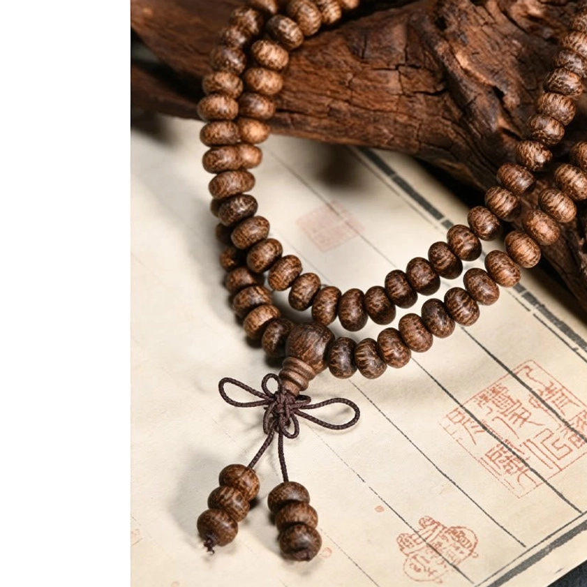 Natural wood 108 bead mala necklace detail showing handcrafted quality and authentic meditation beads