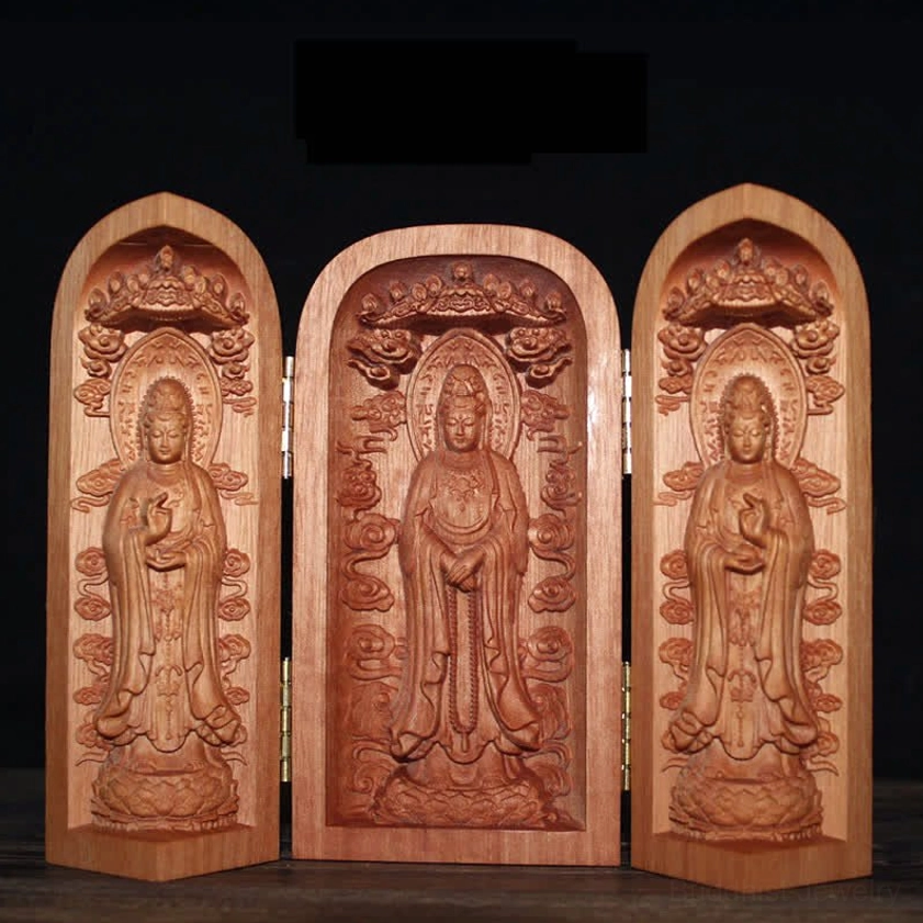 Tri-fold wooden Buddhist shrine featuring standing Buddha figures on lotus pedestals with gilded hinges