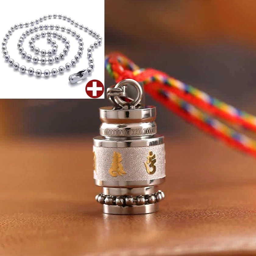 Buddhist wisdom amulet pendant gold-tone finish with Sanskrit mantra engraving close-up view
