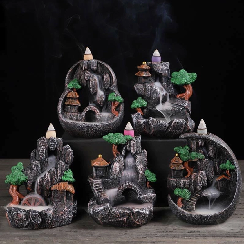 Collection of Buddhist meditation backflow incense burners in multiple designs with active smoke effects