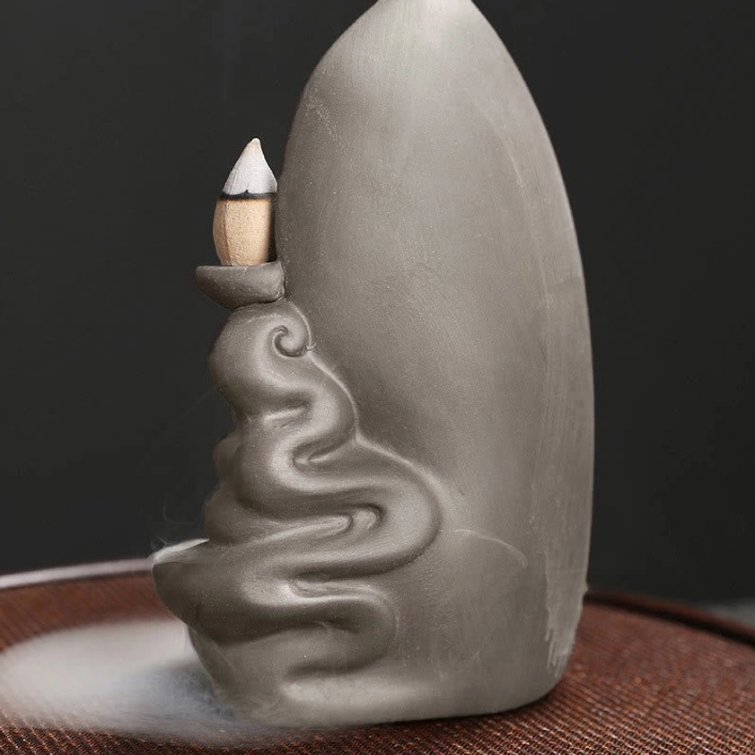 Buddhist backflow incense fountain with Guanyin Buddha figure and intricate details