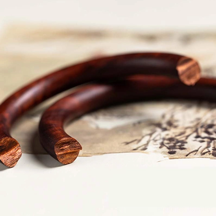 Multiple Buddhist wood bangles collection - showing red sandalwood, ebony, and green sandalwood options