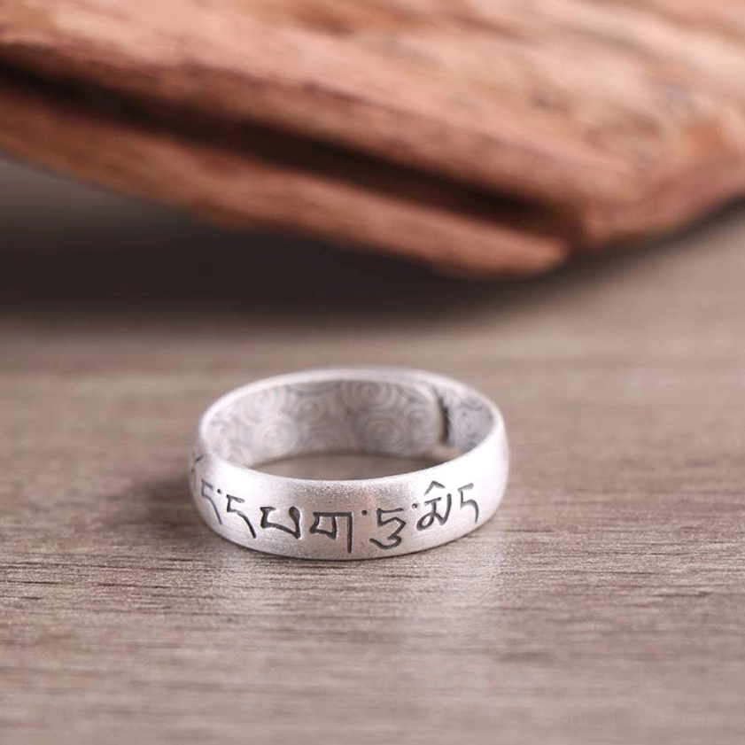 999 sterling silver Buddhist ring collection with multiple symbol designs and adjustable sizing