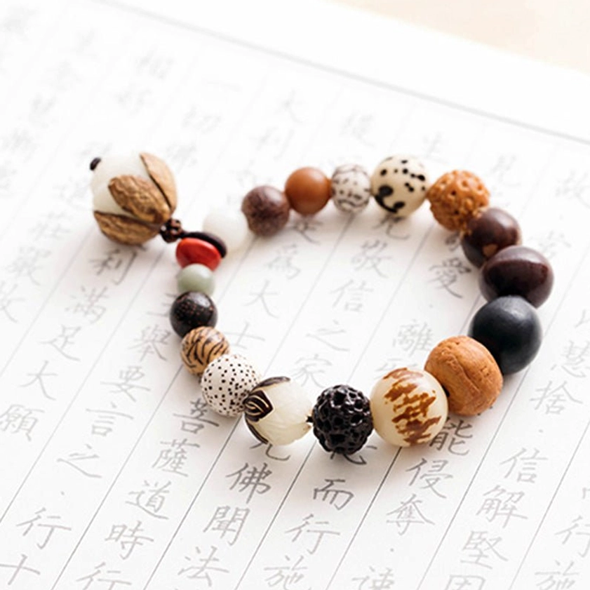 Buddhist bodhi seed mala bracelet with lotus symbol for enlightenment and peace