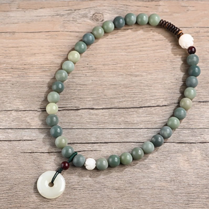 Buddhist bodhi seed double wrap bracelet with green gradient beads, white jade peace buckle, and natural coconut shell accents