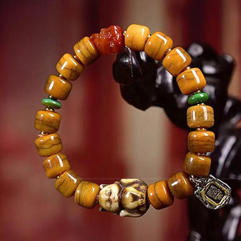 Yellow barrel bone beads with red dzi bead and fox charm bracelet for spiritual protection