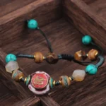 Black blue rope Buddhist bracelet with braided cord and turquoise beads, adjustable meditation bracelet overhead view