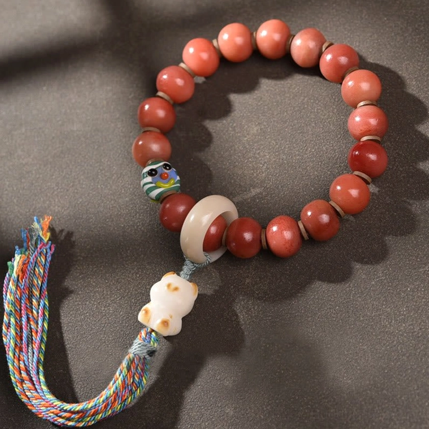 Tibetan Buddhist Red Beaded Bracelet with Bodhi Seed Charm and Multicolor Tassel, Overhead View
