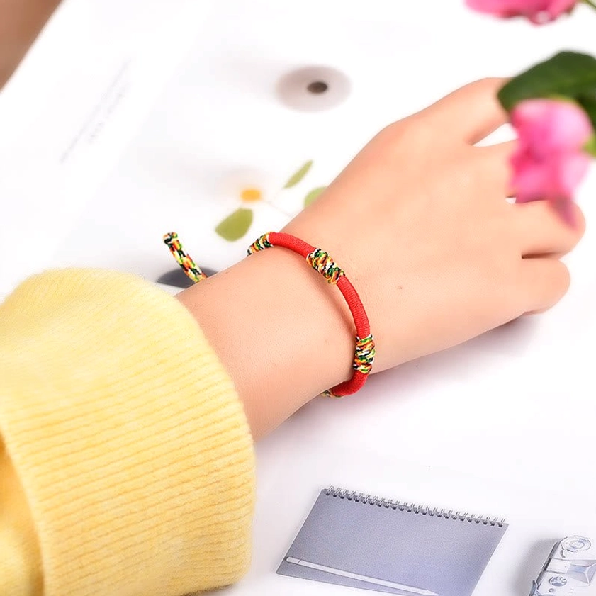 Buddhist protection bracelet worn on wrist demonstrating real wearing effect with colorful sacred knots