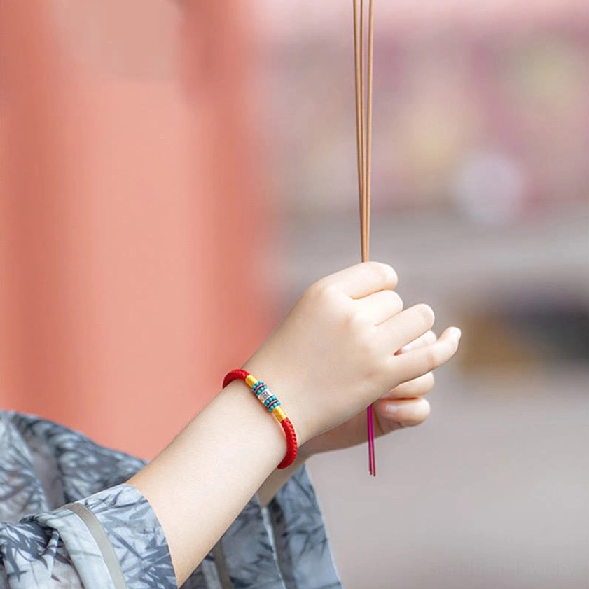 Buddhist string bracelet in natural materials displayed on wrist showing comfort and fit