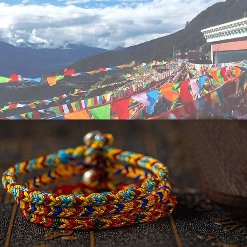 Stacked multicolored Buddhist string bracelets with colorful woven braided design displayed over Tibetan prayer flags mountain landscape scene