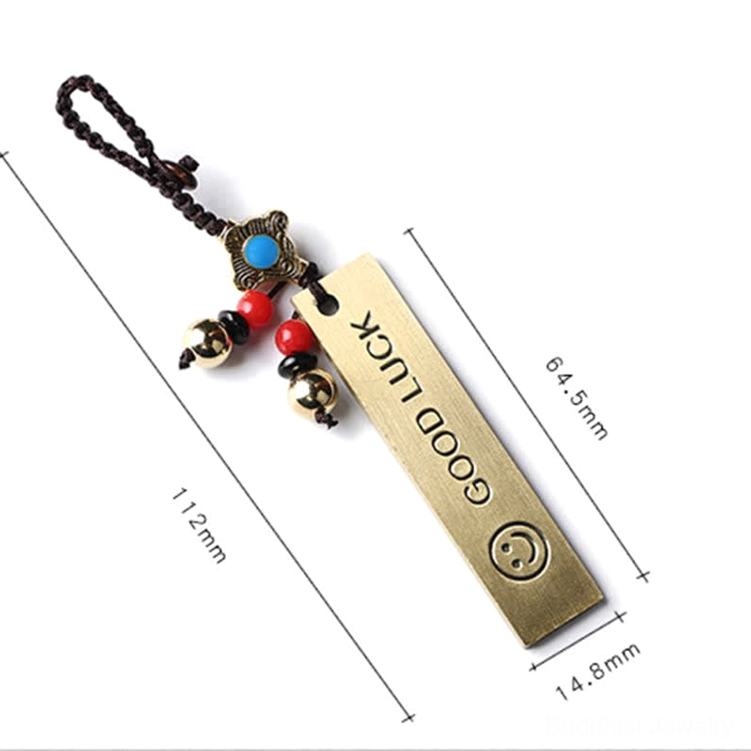 Brass Buddhist keychain with size comparison - demonstrating dimensions and craftsmanship quality of handmade designs