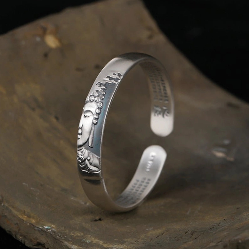 999 sterling silver Buddha head heart sutra cuff bracelet, high-relief Buddha face with curved open band design, inner sutra engravings visible