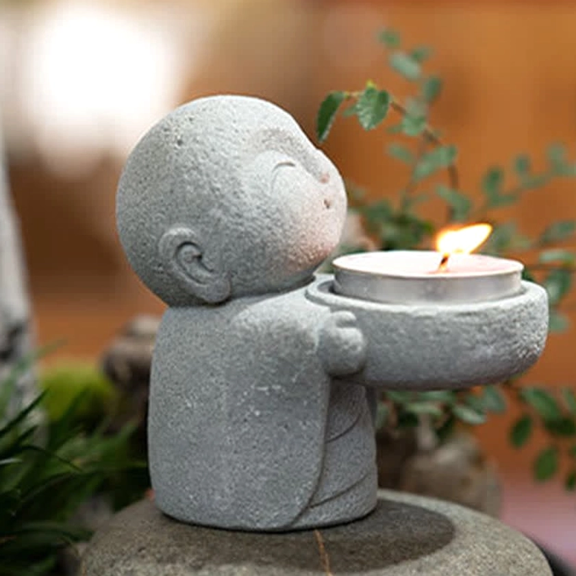 Buddhist spiritual candle holder styling - interior meditation space decoration with serene atmosphere