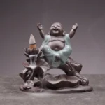 Handcrafted Buddhist ceramic backflow incense burner with Maitreya Buddha, brown ceramic base with celadon glaze, indoor tabletop meditation décor with flowing incense smoke waterfall effect