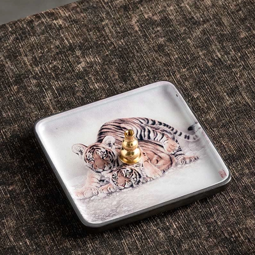 Handmade ceramic incense burner with tiger motif from Buddhist symbolism for strength and protection
