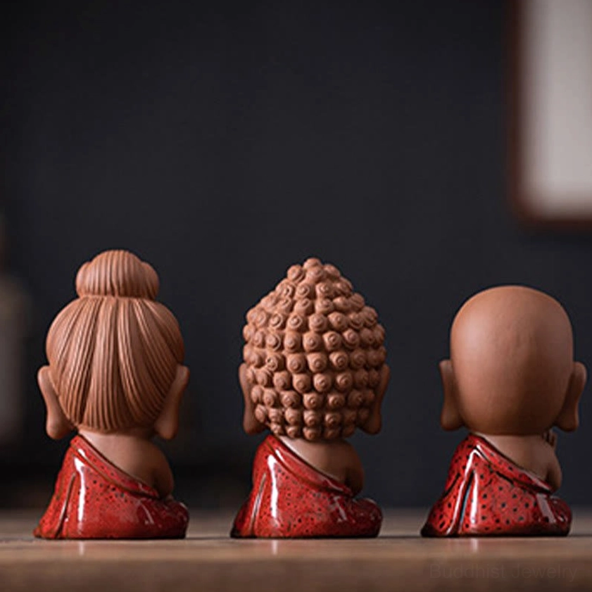 Handcrafted Buddhist ceramic figurine miniature statue with natural terracotta and vibrant hand-glazed details authentic artisan work