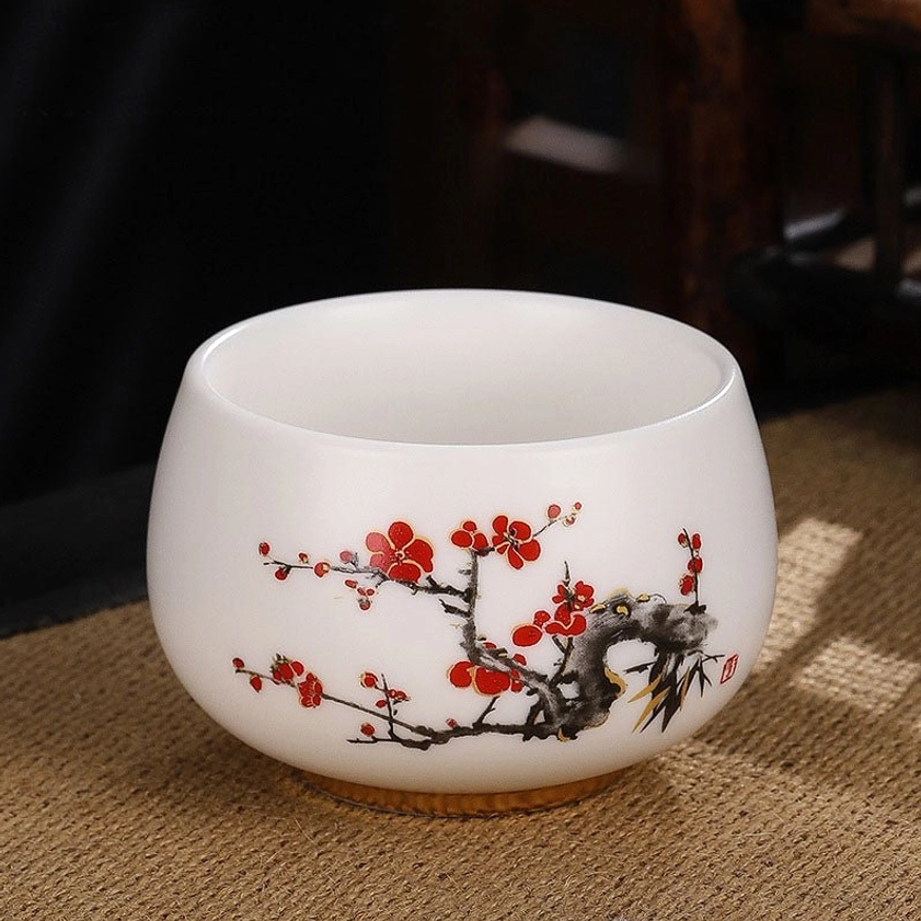Red plum blossom handcrafted ceramic tea cup with traditional gongfu design for mindful tea ceremony