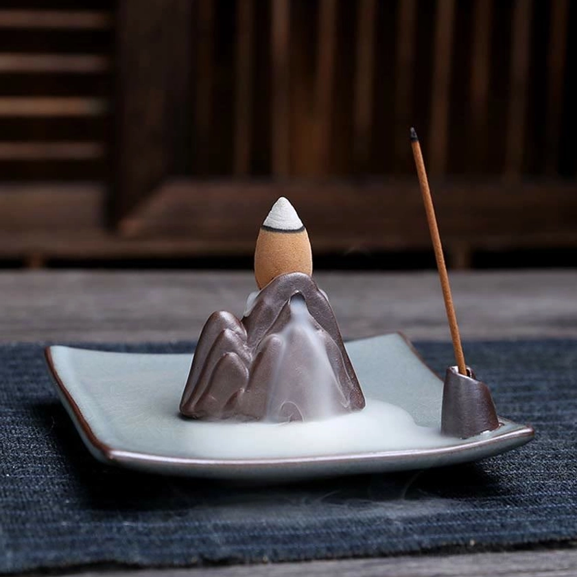 Artisanal ceramic incense burner combining Buddhist sacred geometry with modern wellness aesthetics
