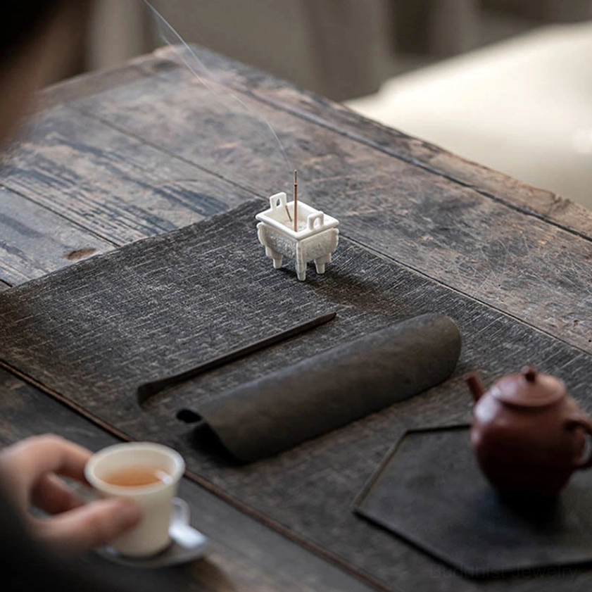 Handcrafted Buddhist ceramic incense burner with intricate carved patterns, ideal for meditation room and spiritual practice