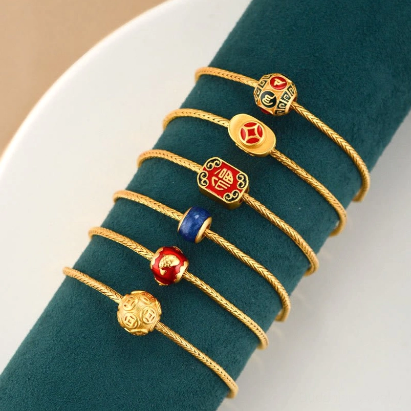 Collection of Buddhist charm bracelets featuring Fu character, koi fish, and gold ingot designs