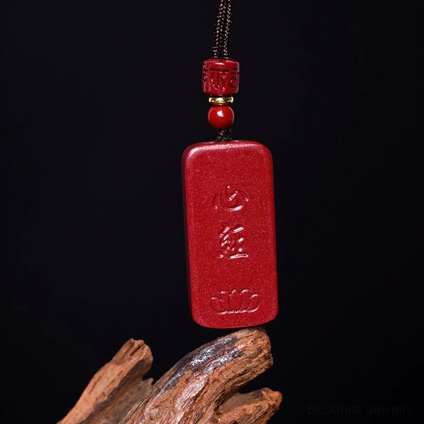 Buddhist prayer pendant necklace featuring cinnabar with spiritual sutra text