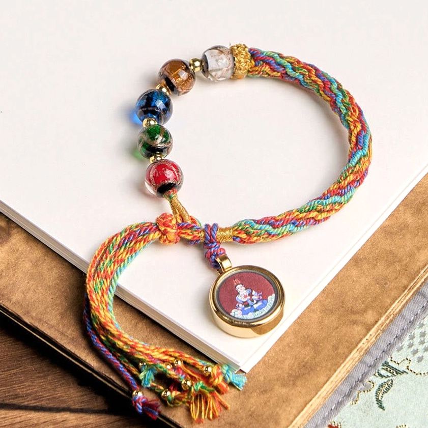 Buddhist color symbolism reference chart showing spiritual meanings of blue, white, red, green, yellow, and black in zodiac natal Buddha bracelet design