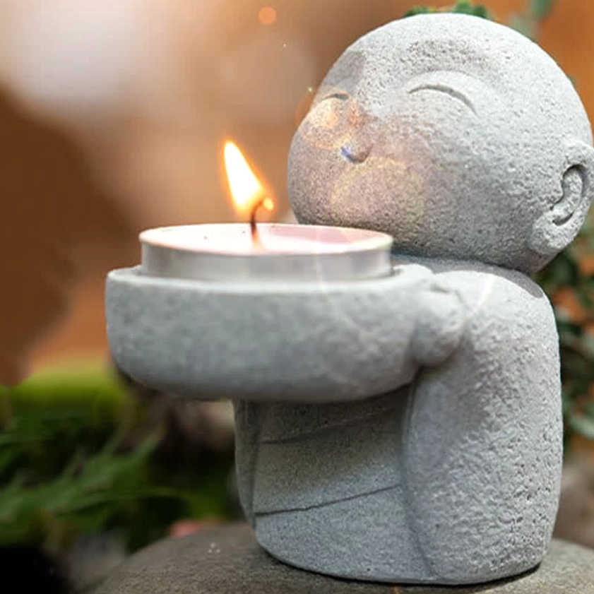 Compassion Buddhism tealight holder product variation - alternative angle showing monk design details