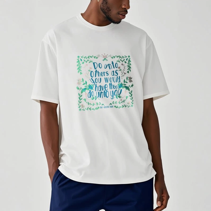 Man wearing white Buddhist graphic t-shirt with teal golden rule floral print side front view torso shot