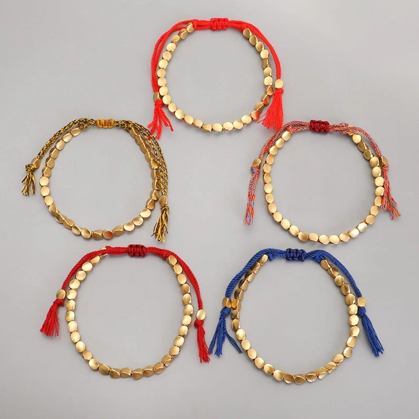 Authentic Buddhist copper bracelet featuring natural matte beads and hand-woven spiritual cord design