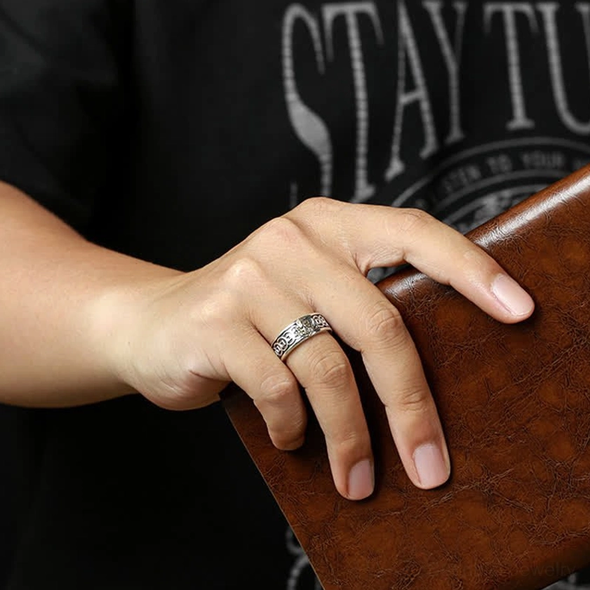 Adjustable Buddhist ring styled on middle finger everyday wear with leather accessory daily styling