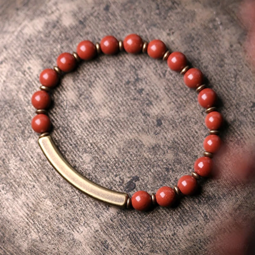 Buddhist crystal healing bracelet collection - multiple styles showing Red Jasper, Moss Agate, and Black Obsidian