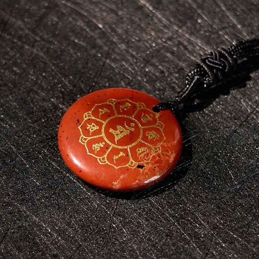 Buddhist crystal necklace pendant collection showcasing multiple stone varieties with Om Mani Padme Hum engravings