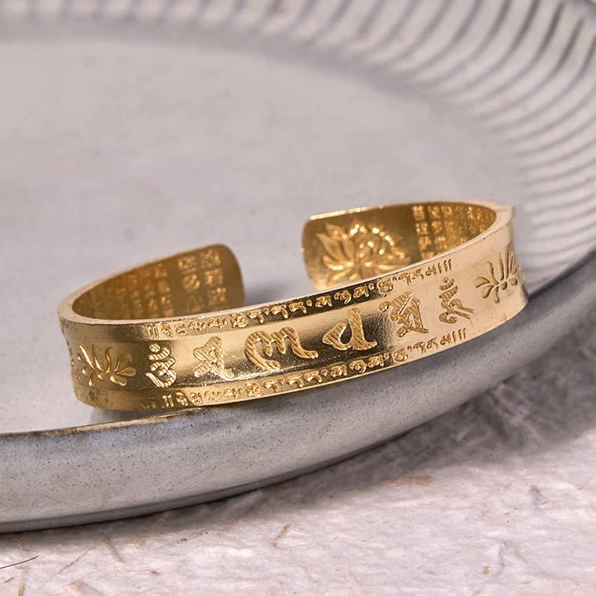 Buddhist cuff bracelet adjustable fit showing inner heart sutra engraving and outer mantra text