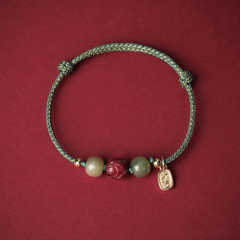 Cyan braided Buddhist string bracelet with Hetian jade beads, cinnabar lotus charm, 14K gold accents, uplifting spiritual energy and protection
