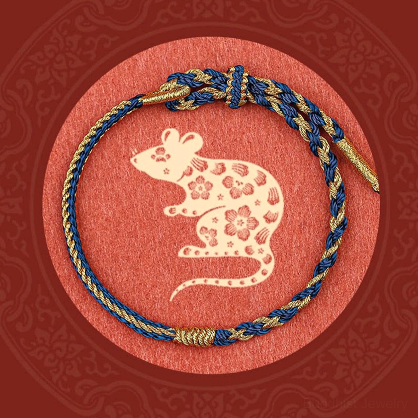 Dark blue handmade Buddhist protection bracelet with woven knot and natural cord