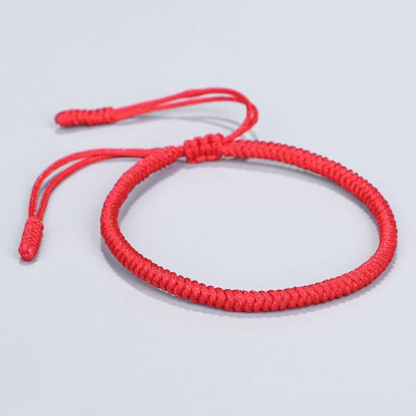 Deep red Buddhist red string bracelet with sturdy woven rope construction and king kong knot adjustable clasp