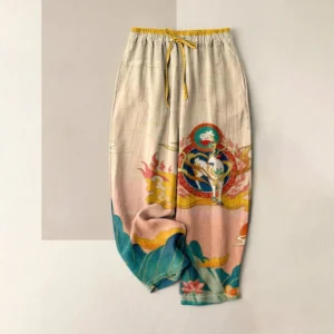 Buddhist deer lotus mountain printed women's cotton harem pants in khaki, flat lay overhead view with spiritual motifs