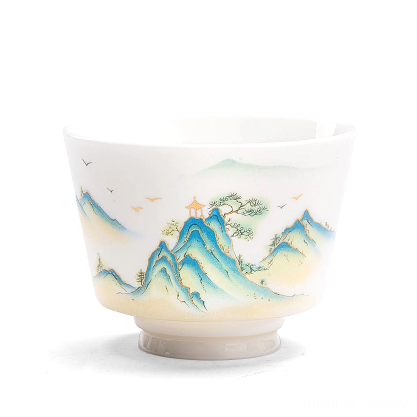 Handcrafted Buddhist porcelain tea cup featuring delicate hand-painted floral patterns and contemplative landscape art